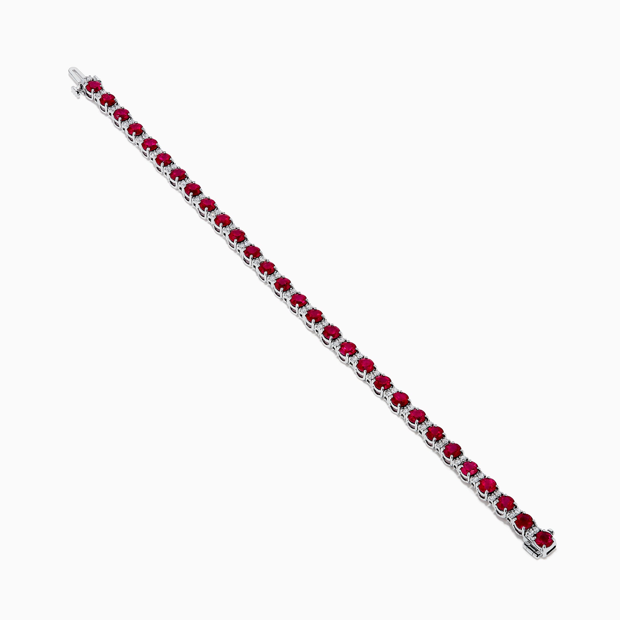 The Ruby Royale 18K White Gold Ruby and Diamond Tennis Bracelet showcases vibrant red rubies in individual prong settings, elegantly displayed against a plain white background.