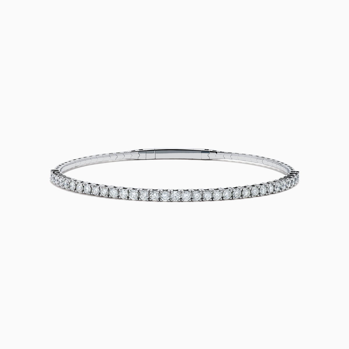 The 14K White Gold Flexible Diamond Bracelet features a slim, elegant design with a single row of sparkling diamonds set around its flexible band, shown against a white background.
