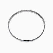 The 14K White Gold Flexible Diamond Bracelet features a slim, elegant design with a single row of sparkling diamonds set around its flexible band, shown against a white background.