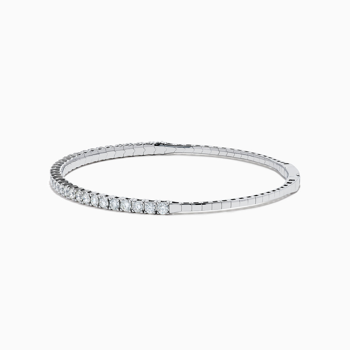 The 14K White Gold Flexible Diamond Bracelet features a slim, elegant design with a single row of sparkling diamonds set around its flexible band, shown against a white background.