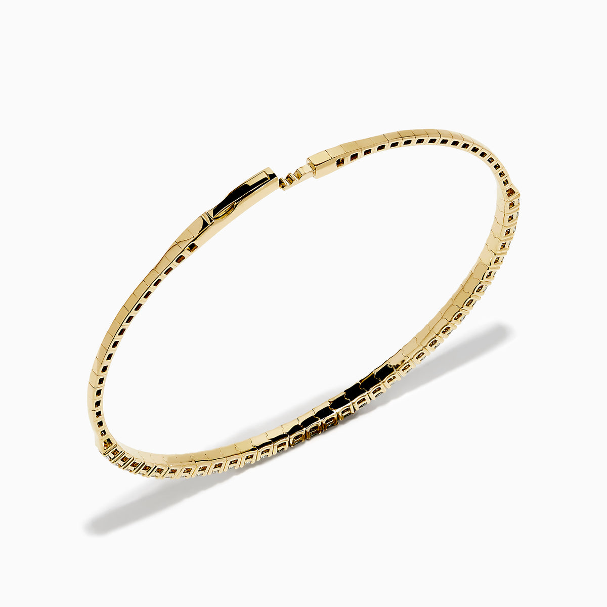 The 14K Yellow Gold Flexible Diamond Bracelet showcases a row of white diamonds on its outer surface, elegantly displayed against a plain white background.