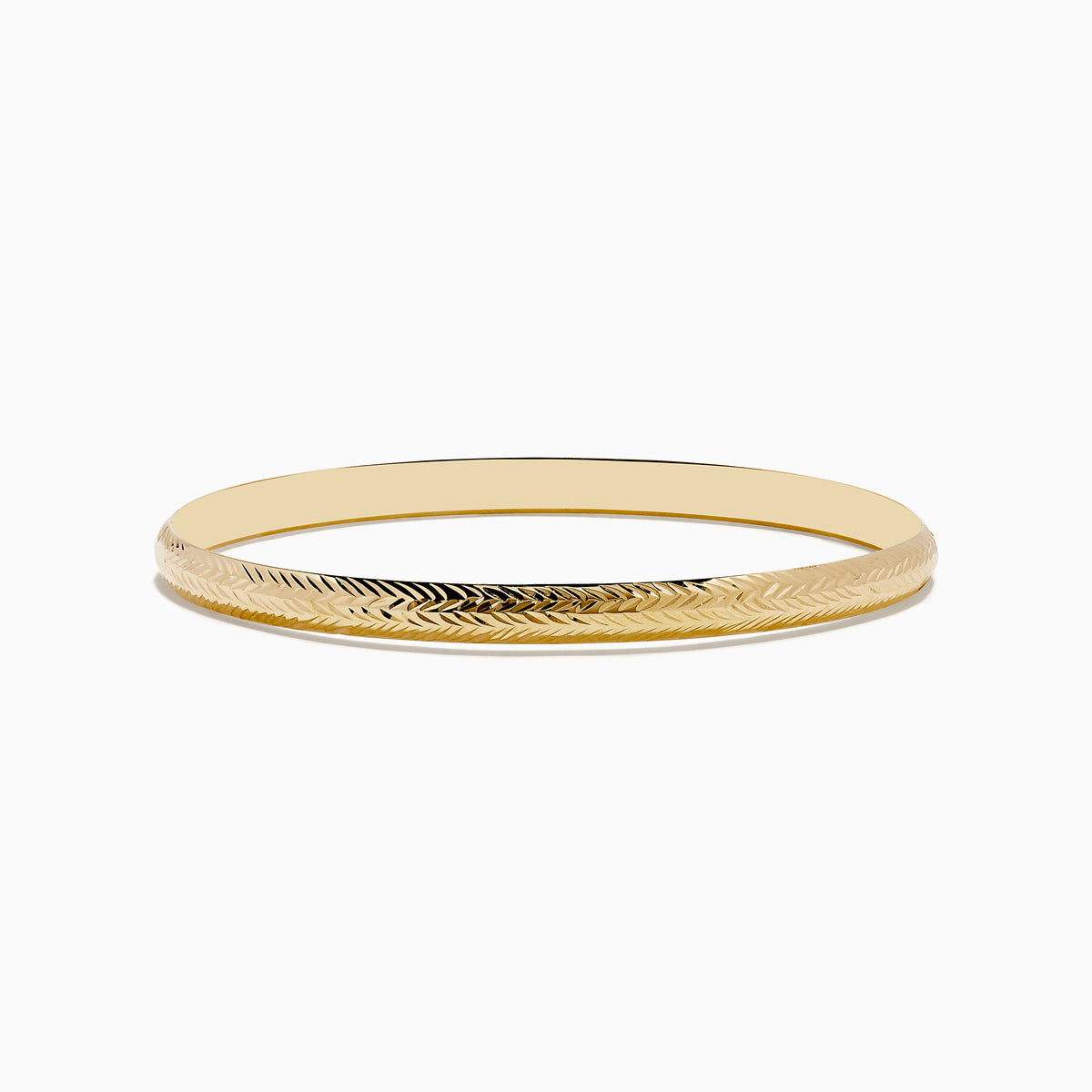The 14K Yellow Gold Chevron Bangle features a subtle engraved pattern along its outer surface and is displayed on a white background.