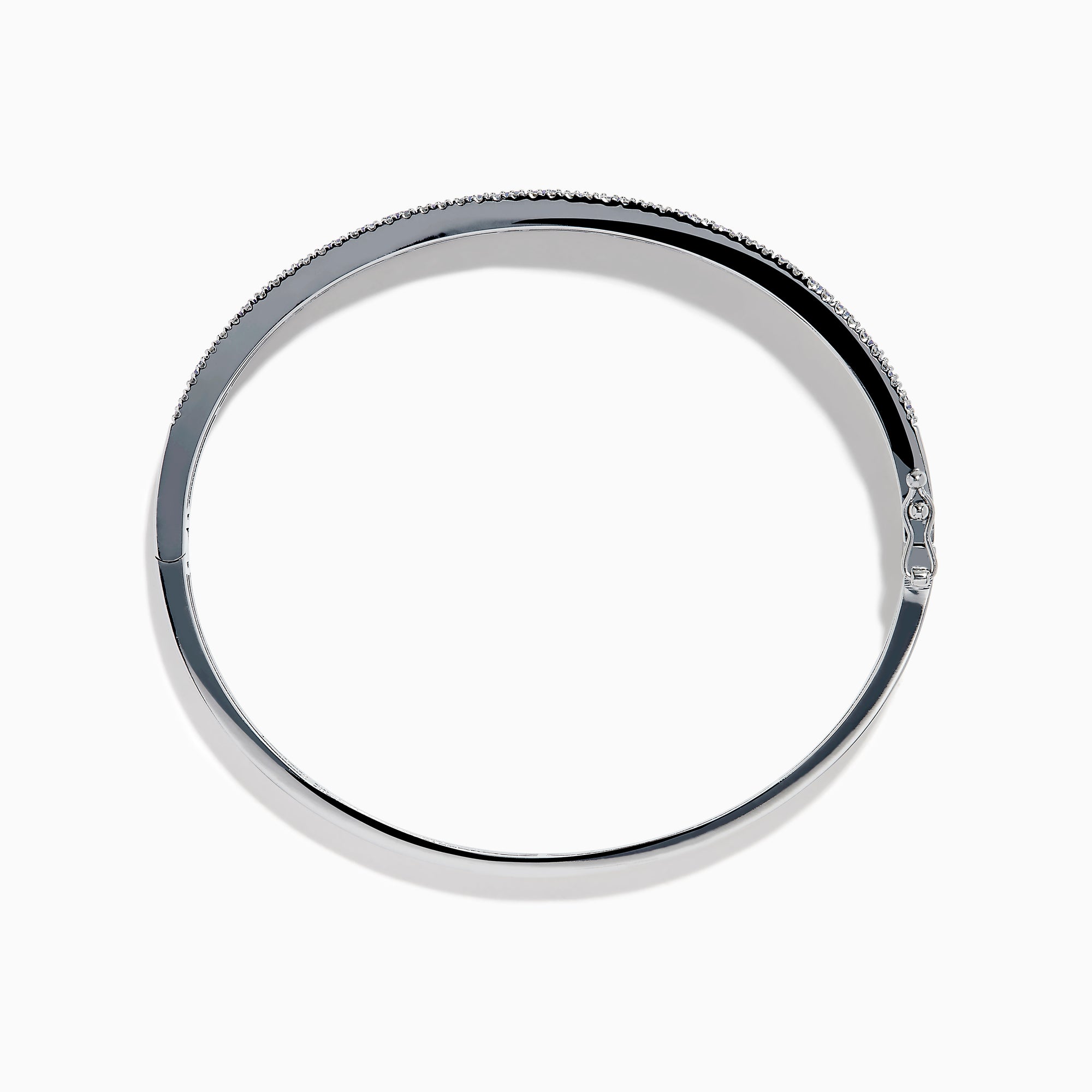 The Nahla Siri 14K White Gold Tanzanite and Diamond Bangle showcases a row of square-cut blue tanzanites between two rows of sparkling diamonds, elegantly displayed against a white backdrop.