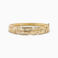 The D'oro 14K Yellow Gold Interwoven Crossover Bangle features multiple slim, interlaced bands adorned with evenly spaced round white gemstones, set in yellow gold for a radiant look.