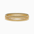 The D'Oro 14K Yellow Gold Diamond Stretch Bracelet features rounded beads and a central row of sparkling diamonds in a symmetrical, elegant design.