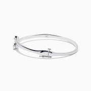 A sleek, minimalist Pave Classica 14K White Gold Two-of-Us Diamond Bangle with a stirrup-shaped clasp is displayed on a white background—an elegant Effy design for timeless style.