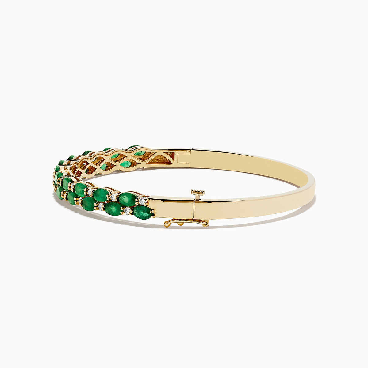 The 14K Yellow Gold Emerald and Diamond Bangle features two rows of round emeralds bordered by smaller diamonds, with a side clasp.