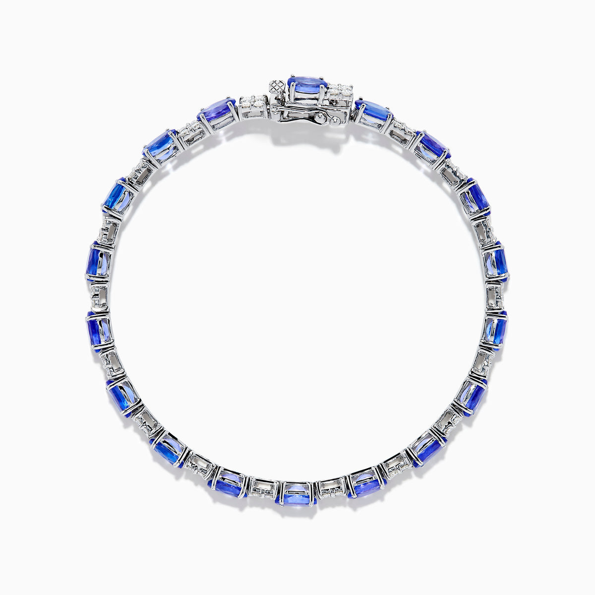 The 14K White Gold Tanzanite and Diamond Tennis Bracelet features alternating oval tanzanite gemstones and sparkling diamonds set against a plain white background.