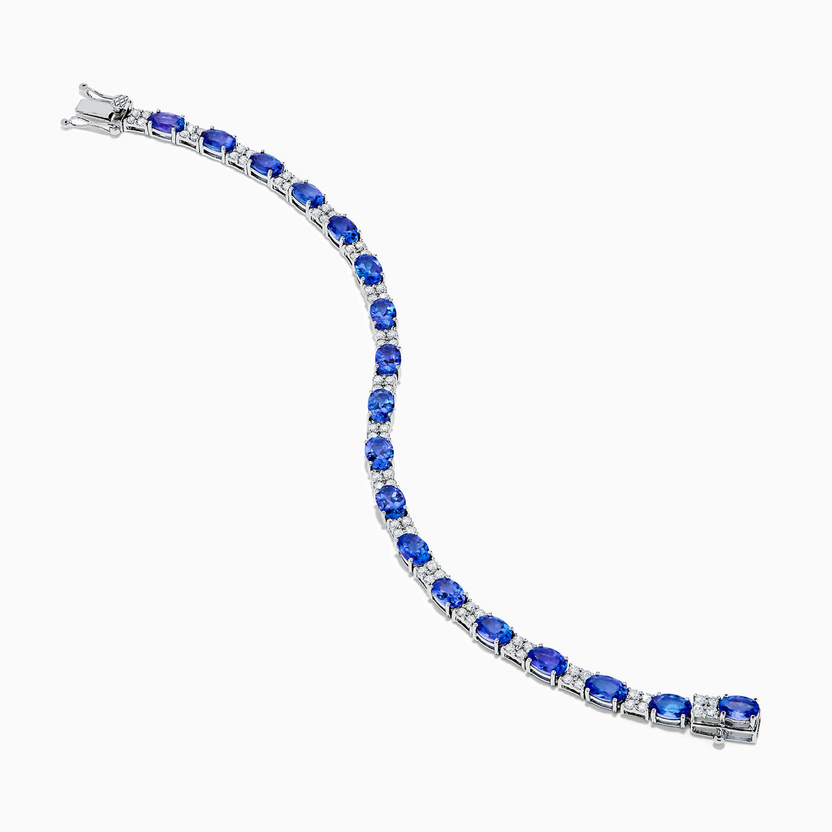 The 14K White Gold Tanzanite and Diamond Tennis Bracelet features alternating oval tanzanite gemstones and sparkling diamonds set against a plain white background.