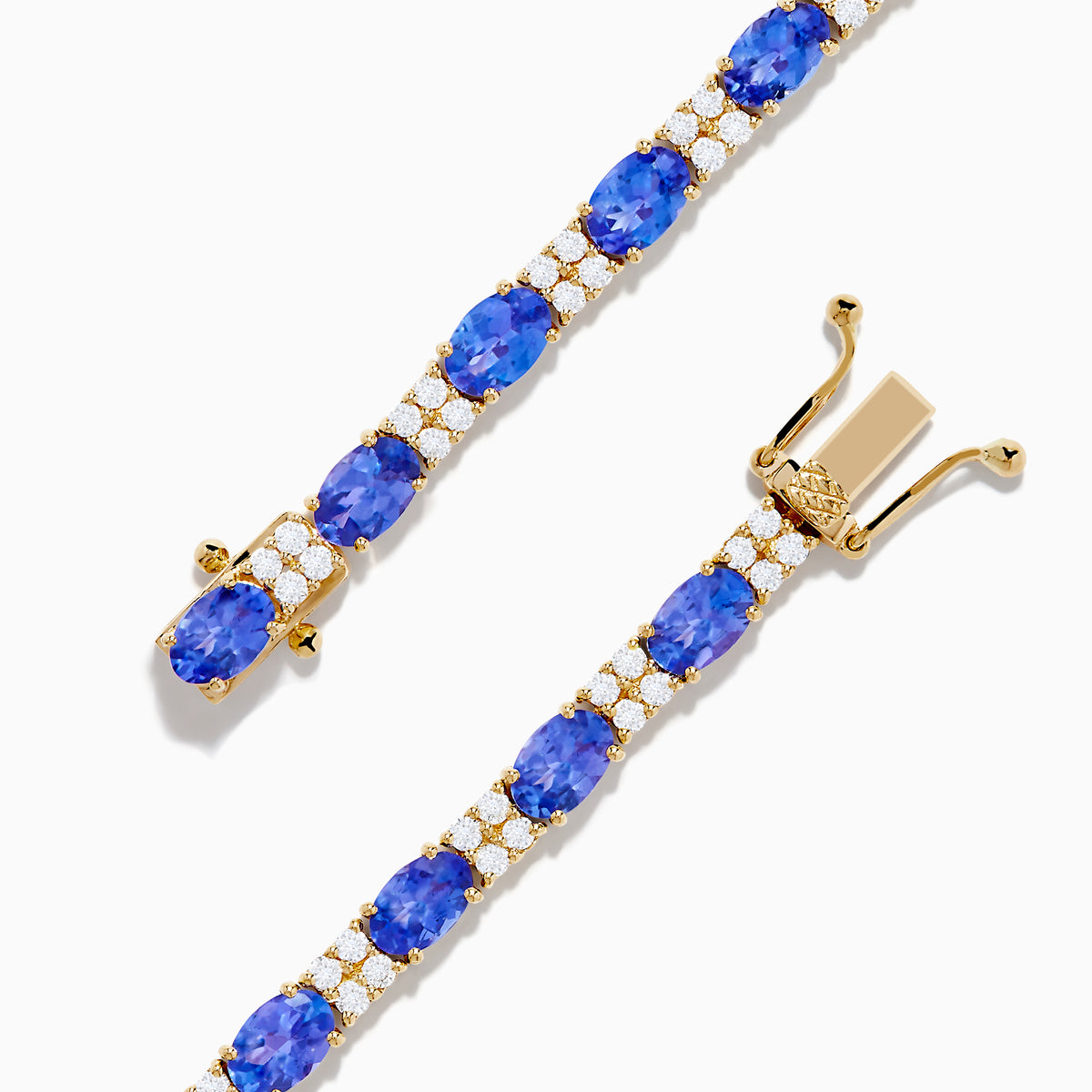 The 14K Yellow Gold Tanzanite and Diamond Tennis Bracelet showcases alternating round blue tanzanites and sparkling diamonds in a single row, secured with a reliable clasp.