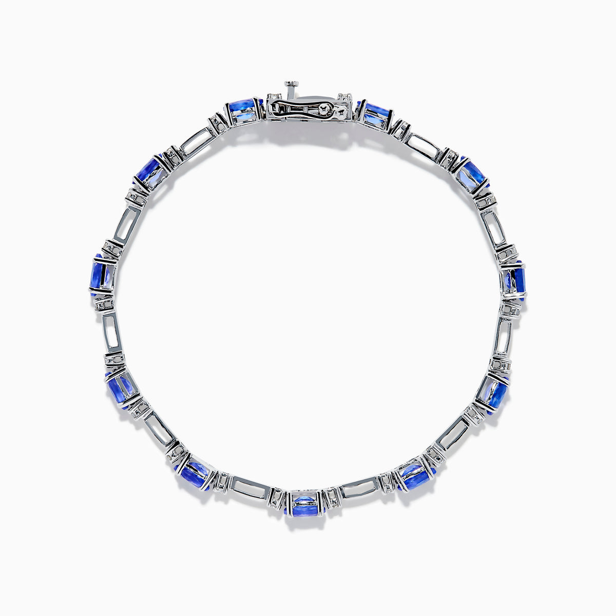 The 14K White Gold Tanzanite and Diamond Station Bracelet features vibrant oval-cut tanzanites and sparkling diamonds evenly spaced along the band, connected by delicate links for a timeless, elegant look.
