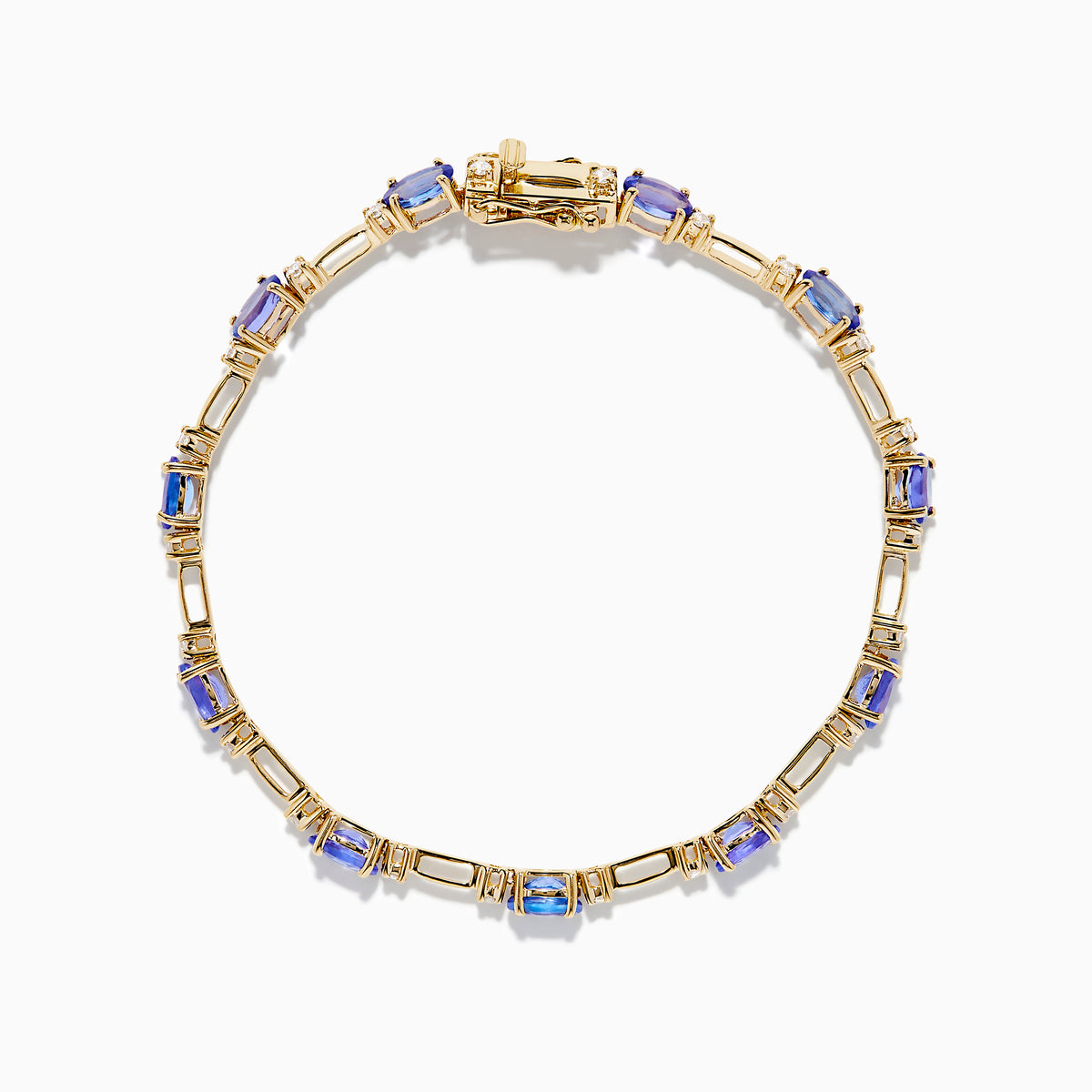 The 14K Yellow Gold Tanzanite and Diamond Station Bracelet showcases evenly spaced oval tanzanites set in gold links, each accented by sparkling diamonds, creating an elegant look against a white background.