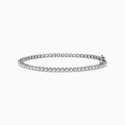 The 14K White Gold 1.0 Ct. Diamond Tennis Bracelet showcases a single row of round sparkling diamonds set in a lustrous white gold band, displayed against a plain white background.