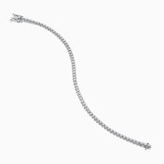 The 14K White Gold 1.0 Ct. Diamond Tennis Bracelet showcases a single row of round sparkling diamonds set in a lustrous white gold band, displayed against a plain white background.