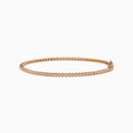 The 14K Rose Gold 0.25 Ct. Diamond Tennis Bracelet features a continuous row of sparkling round-cut diamonds, elegantly photographed on a white background.
