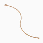 The 14K Rose Gold 0.25 Ct. Diamond Tennis Bracelet features a continuous row of sparkling round-cut diamonds, elegantly photographed on a white background.