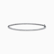 The 14K White Gold 0.25 Ct. Diamond Tennis Bracelet features a row of sparkling diamonds set in a slender band, shown against a white background.