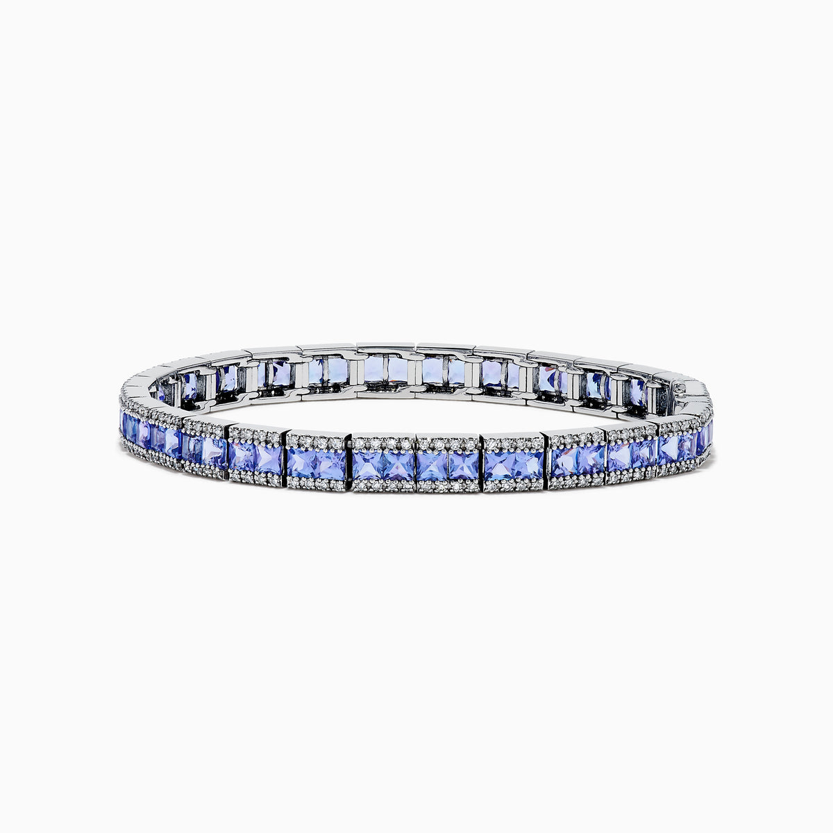 The Nahla Siri 14K White Gold Tanzanite and Diamond Tennis Bracelet features square blue tanzanites bordered by sparkling diamonds, elegantly set in a classic tennis bracelet design.