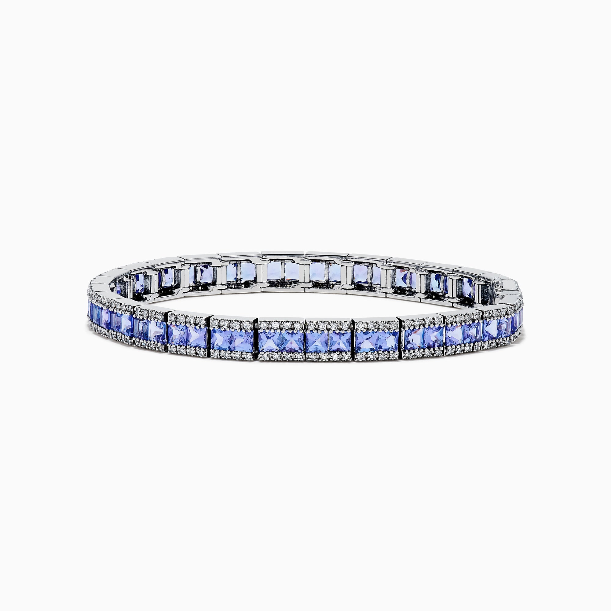 The Nahla Siri 14K White Gold Tanzanite and Diamond Tennis Bracelet features square blue tanzanites bordered by sparkling diamonds, elegantly set in a classic tennis bracelet design.