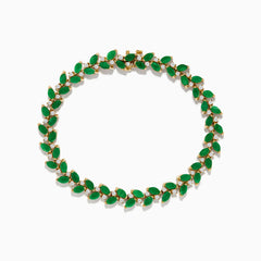 The Brasilica 14K Yellow Gold Emerald and Diamond Bracelet showcases alternating marquise-shaped emeralds and small round diamonds in a leaf-inspired pattern, forming a complete oval design.