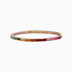 The Watercolors 14K Rose Gold Multi Sapphire Bracelet features square-cut sapphires in a gradient rainbow design, elegantly set in a thin rose gold band and shown against a white background.