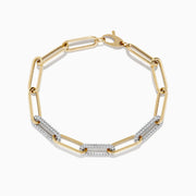 The Duo 14k Two-Tone Gold Paperclip Pave Diamond Bracelet features elongated links, some adorned with pavé diamonds, and is shown on a white background.