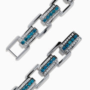 The Men's 14K White Gold Blue and White Diamond Link Bracelet features rectangular links with blue and white diamonds in geometric patterns set against a white gold background.