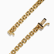 The 14K Yellow Gold Tanzanite and Diamond Chain Link Bracelet features a central triangular tanzanite gem, accented by rows of sparkling diamonds and a polished gold chain link band with a secure clasp.