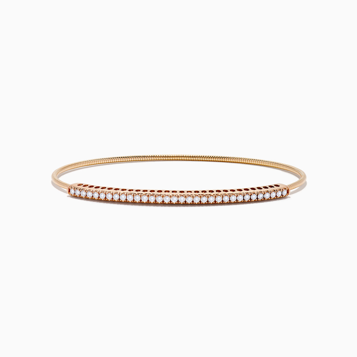 The 14K Rose Gold Flexible Diamond Bangle features a sleek row of sparkling white diamonds along the top, offering a simple, elegant, and symmetrical design with a smooth polished finish.