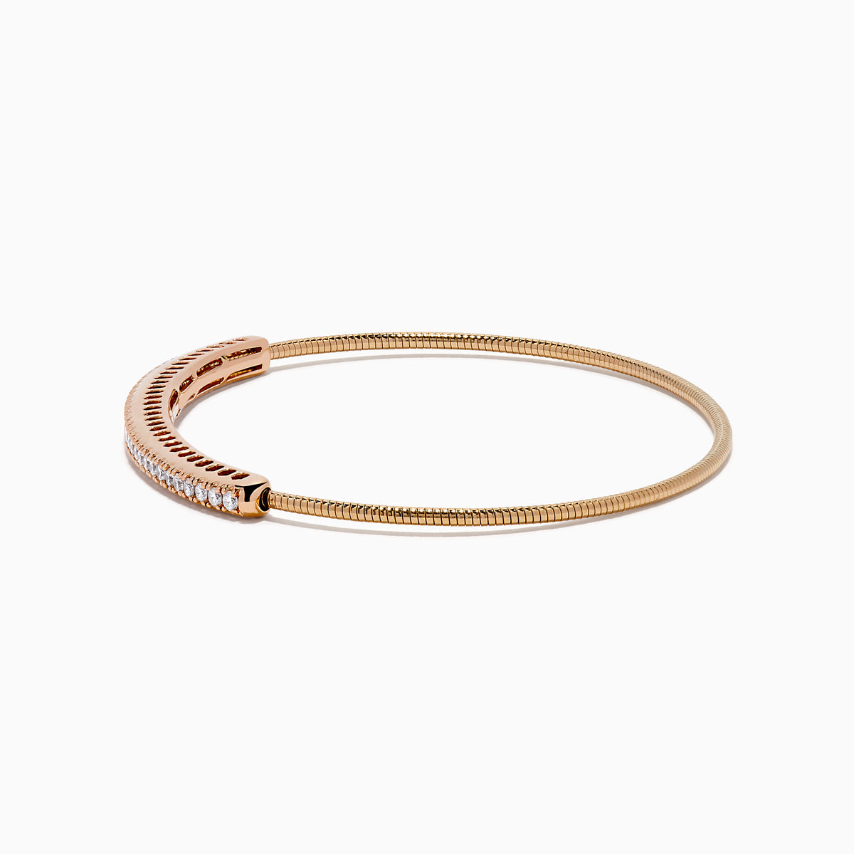 The 14K Rose Gold Flexible Diamond Bangle features a sleek row of sparkling white diamonds along the top, offering a simple, elegant, and symmetrical design with a smooth polished finish.