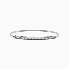 The 14K White Gold Flexible Diamond Bangle features a row of sparkling diamonds set along the top in a minimalist, elegant design, displayed on a plain white background.