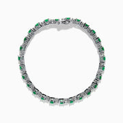The Brasilica 14K White Gold Emerald and Diamond Tennis Bracelet features alternating round green emeralds and clear diamonds, beautifully displayed on a white background.