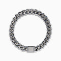 The Men's Sterling Silver Diamond Cuban Link Bracelet features a thick Cuban link chain and a rectangular clasp set with small diamonds, displayed in a circular shape on a white background.