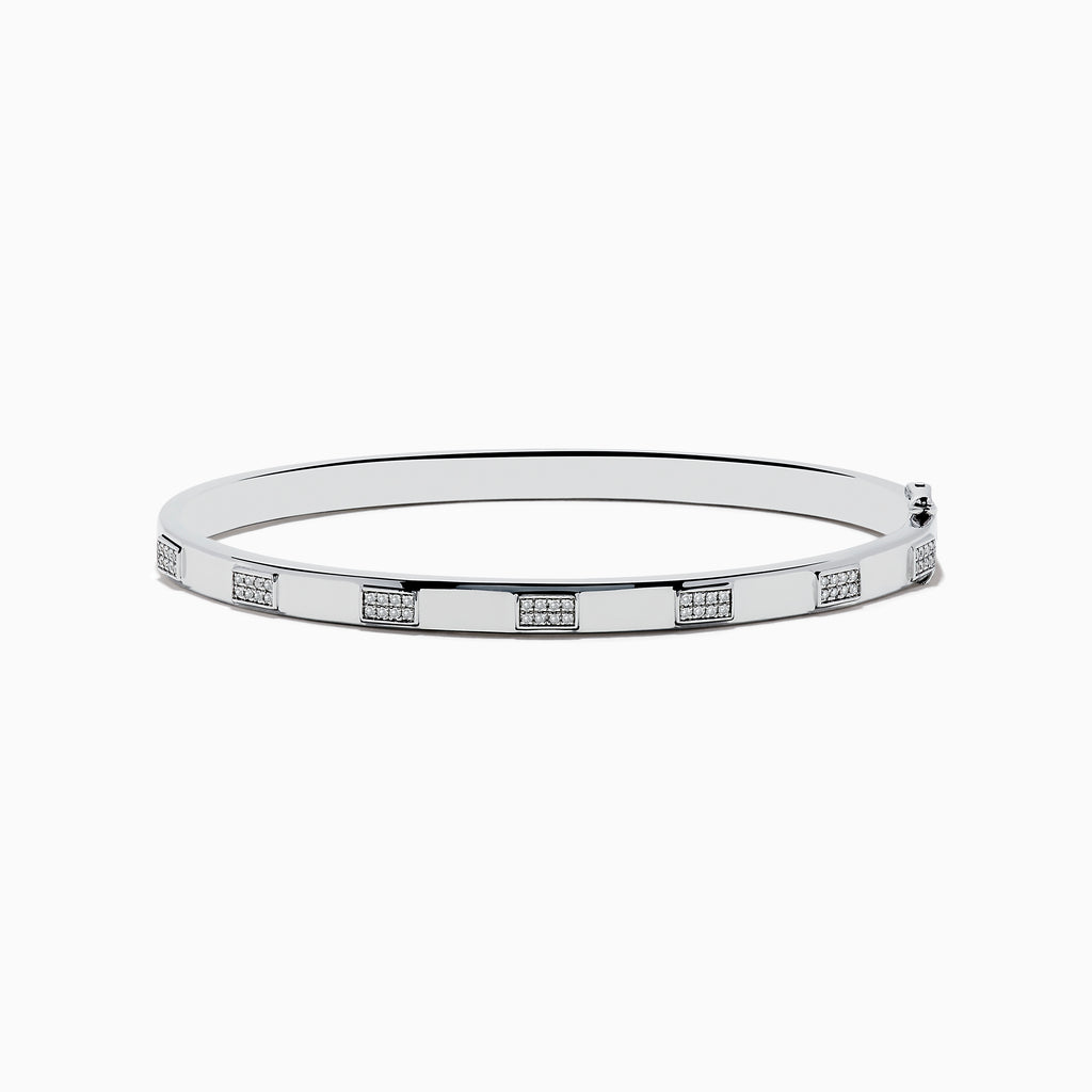 The 925 Sterling Silver and Diamond Bangle features a sleek design with repeating square sections, each set with sparkling diamond-like clear stones.
