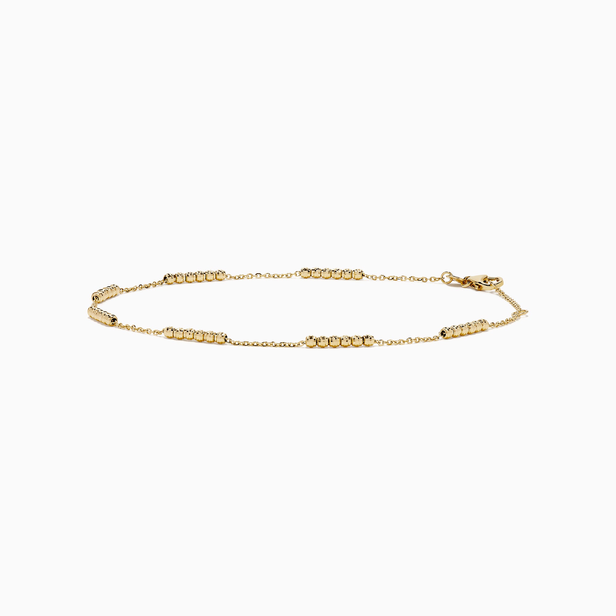 The 14K Yellow Gold Beaded Station Anklet features a delicate fine chain with evenly spaced bead clusters and a secure lobster clasp.