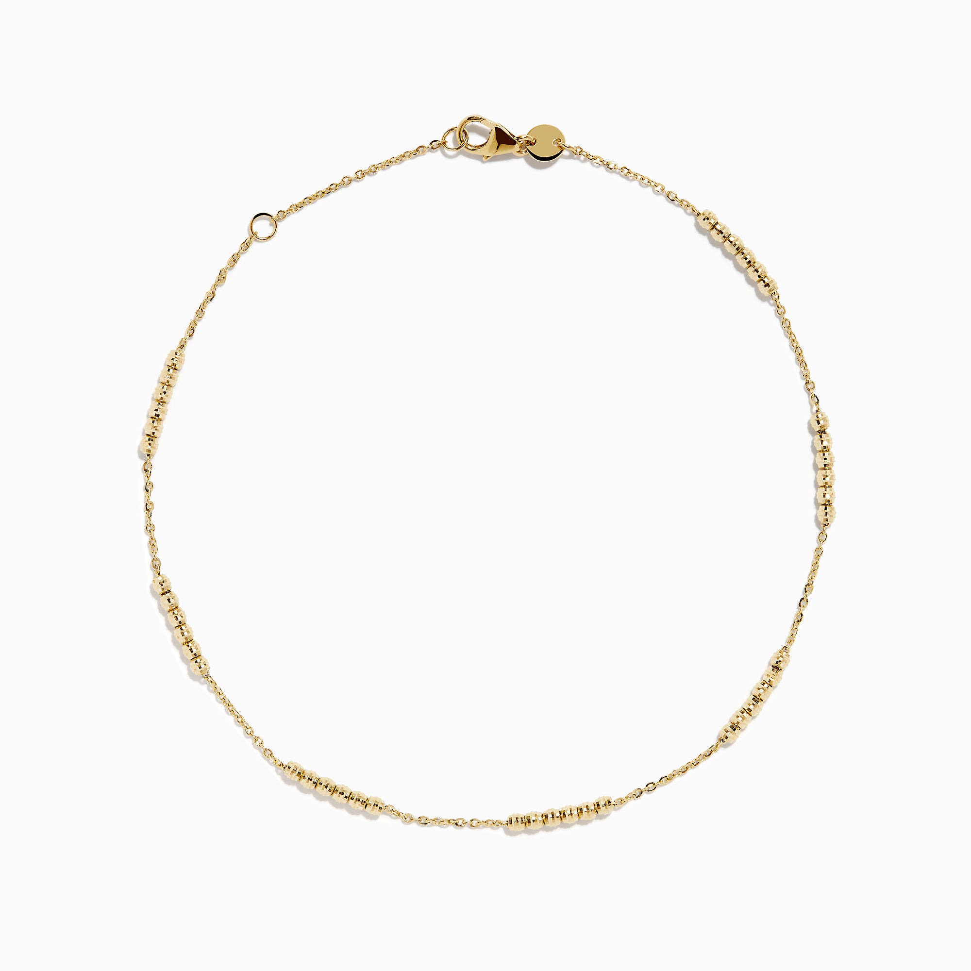 The 14K Yellow Gold Beaded Station Anklet features a delicate fine chain with evenly spaced bead clusters and a secure lobster clasp.