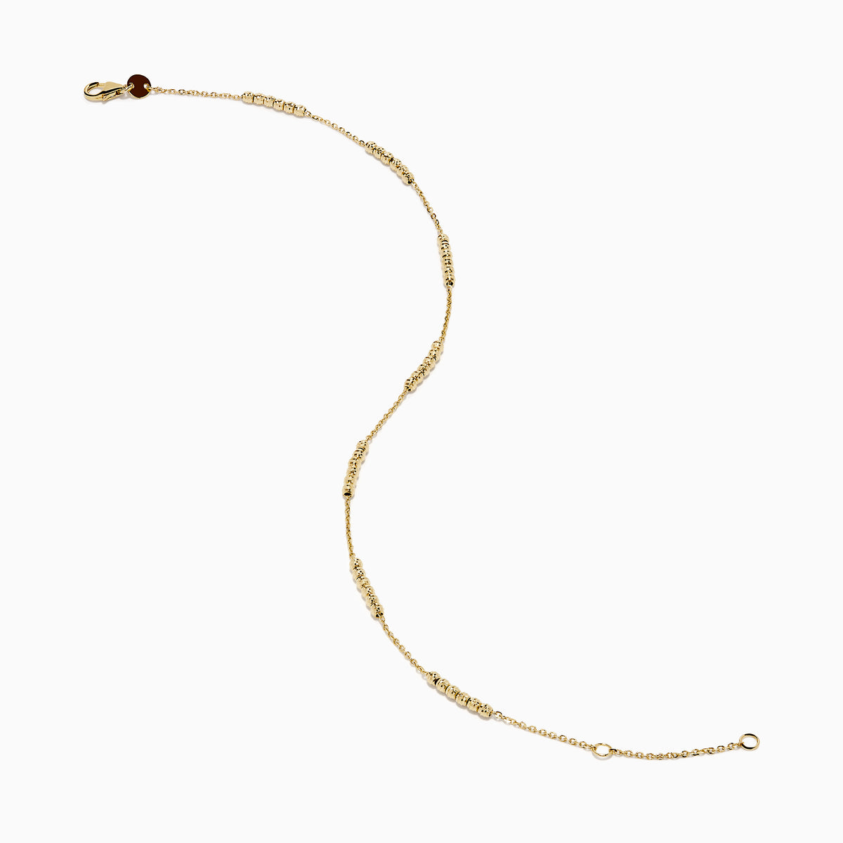 The 14K Yellow Gold Beaded Station Anklet features a delicate fine chain with evenly spaced bead clusters and a secure lobster clasp.