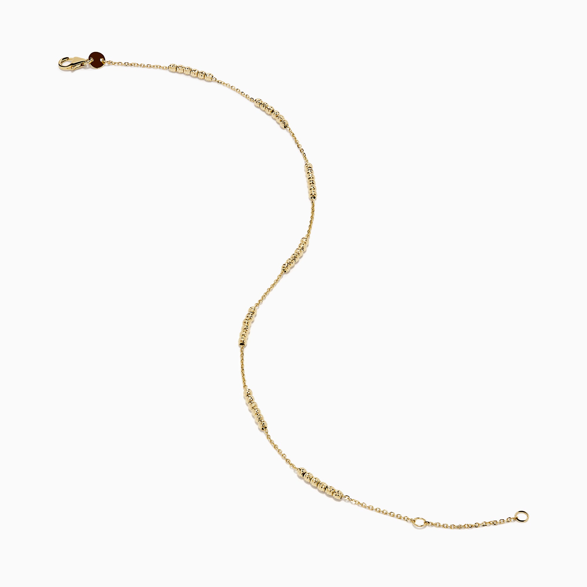 The 14K Yellow Gold Beaded Station Anklet features a delicate fine chain with evenly spaced bead clusters and a secure lobster clasp.