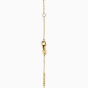 The 14K Yellow Gold Beaded Station Anklet features a delicate fine chain with evenly spaced bead clusters and a secure lobster clasp.