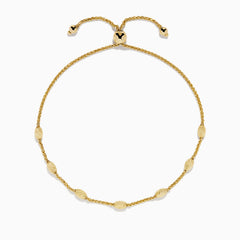 The 14K Yellow Gold Wheat Bolo Chain Bracelet features a twisted rope design with evenly spaced textured gold beads and an adjustable sliding clasp with decorative end pieces.