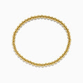 The 14K Yellow Gold Bead Bracelet features smooth, shiny, uniformly sized beads arranged in a circle on a white background.