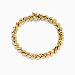 A 14K yellow gold San Marco chain bracelet, 7.5 long, features large twisted oval links and a secure clasp, displayed in a circular shape on a white background. Matching necklace available.