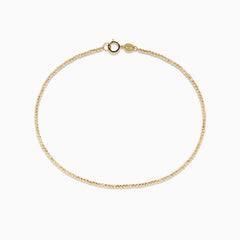 The 14K Yellow Gold Bead Bracelet features a delicate gold chain and small round clasp, shown on a plain white background.