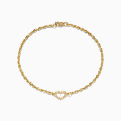 The 14K Yellow Gold Open Heart Rope Chain Bracelet 7.5 features a rope chain, an open heart centerpiece, and a secure lobster clasp, beautifully displayed on a plain white background.