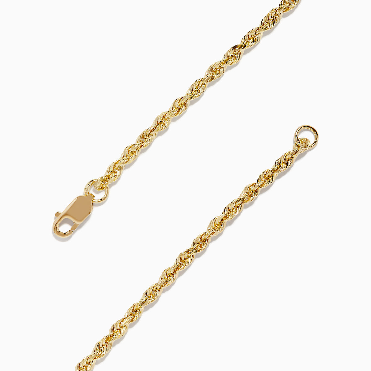 The 14K Yellow Gold Open Heart Rope Chain Bracelet 7.5 features a rope chain, an open heart centerpiece, and a secure lobster clasp, beautifully displayed on a plain white background.