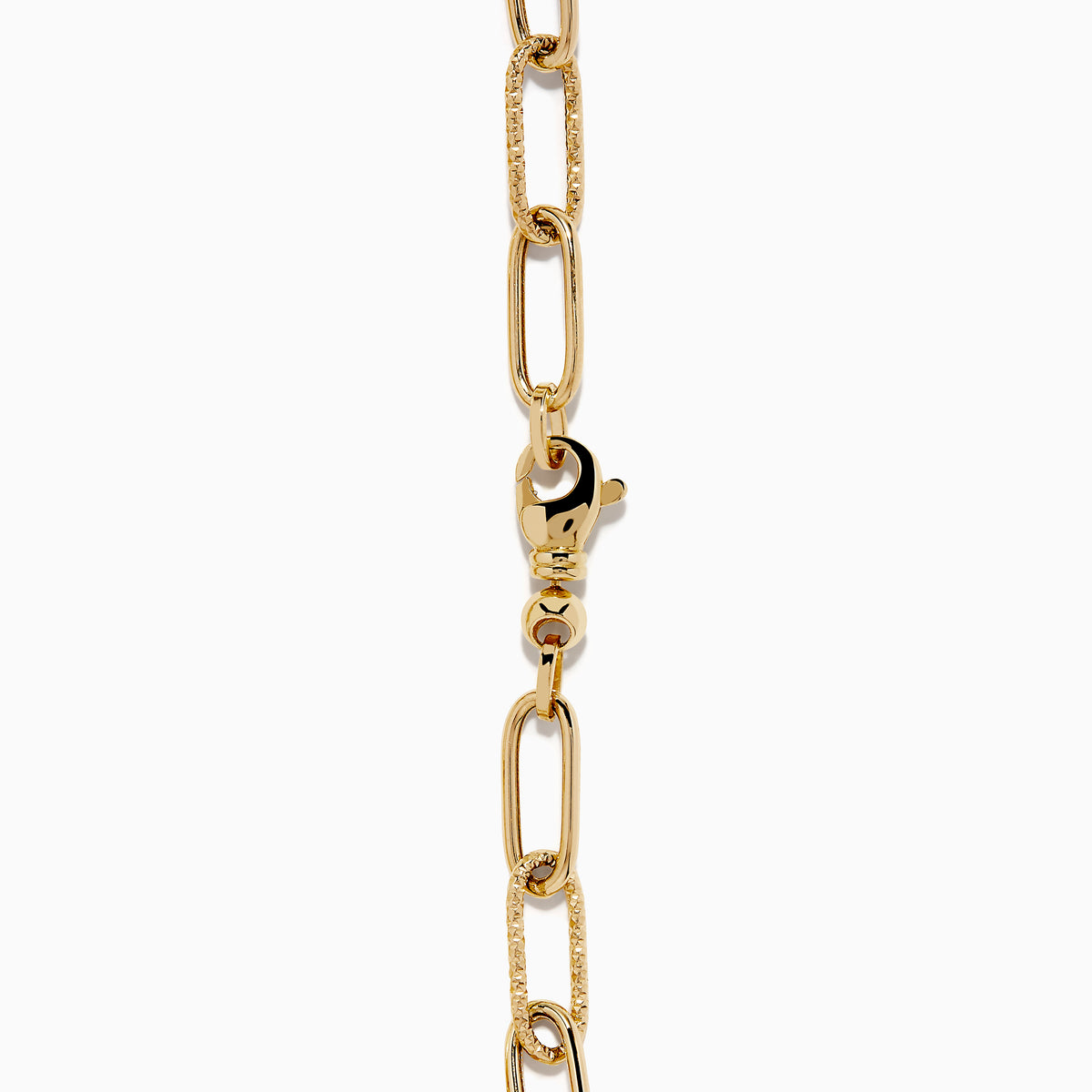 A 14K yellow gold paperclip chain bracelet featuring elongated textured links and a heart charm at the center, displayed on a white background.
