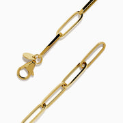 The 14K Yellow Gold Paperclip Bracelet with Padlock Charm features elongated links and a central padlock charm.