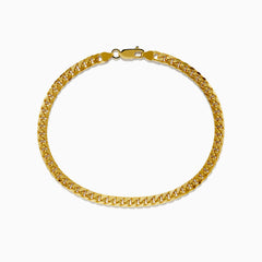 The Mens 14K Yellow Gold 4.5mm Solid Cuban Domed 9 Bracelet is shown in a circular shape, highlighting its domed curb link design and lobster clasp on a plain white background.