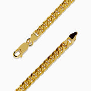 The Mens 14K Yellow Gold 4.5mm Solid Cuban Domed 9 Bracelet is shown in a circular shape, highlighting its domed curb link design and lobster clasp on a plain white background.