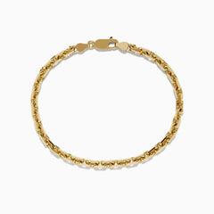The Mens 14K Yellow Gold Solid Chain Link Bracelet 8.5 features a lobster clasp and is displayed in a circular shape on a plain white background.